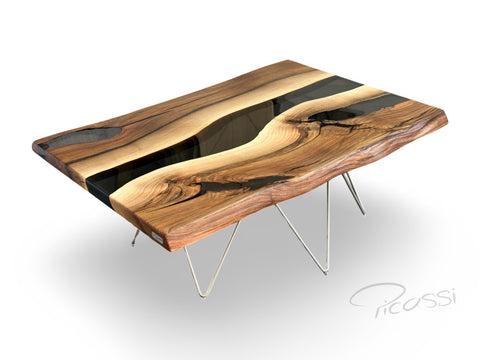 Tisch aus Nussbaum Massivholz mit Epoxidharz auf einem denzenten Edelstahl Gestell